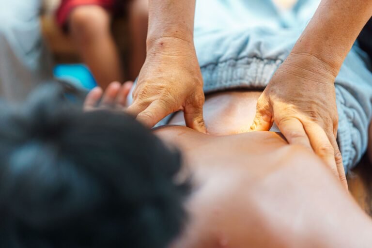 An outdoor therapeutic massage focused on the back, offering relaxation and tension relief.